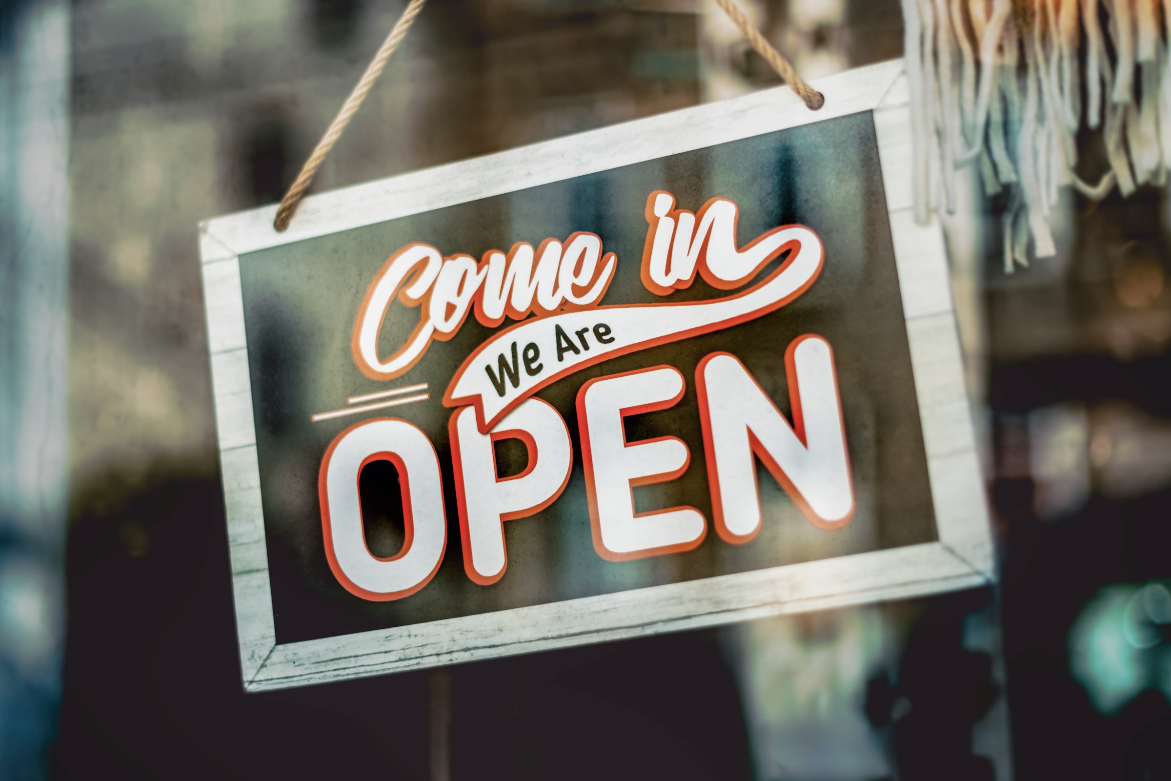 Architectural storefront
              glass vinyl signage
